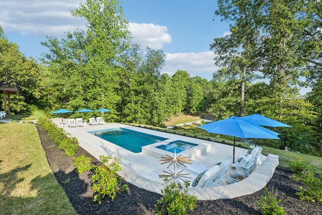 view of swimming pool with a yard, a patio area, and a pool with connected hot tub