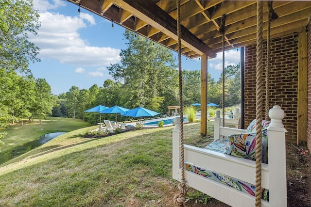 view of yard featuring an outdoor pool