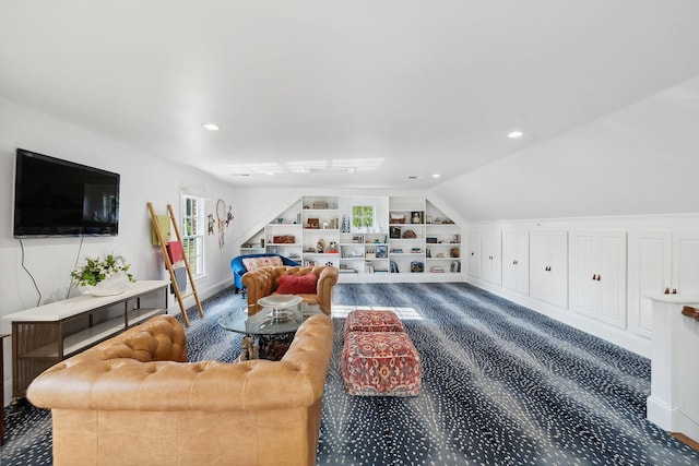 living room featuring built in shelves, vaulted ceiling, and recessed lighting