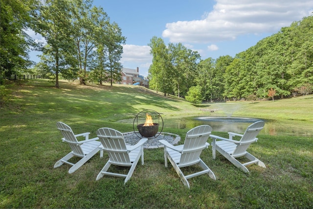 view of yard with a fire pit