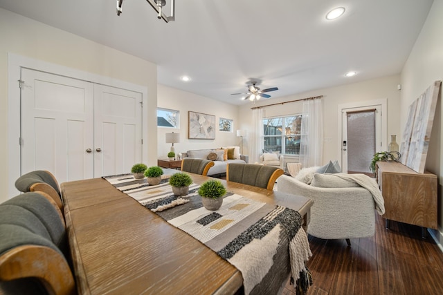 dining space with dark wood-style floors, a ceiling fan, and recessed lighting