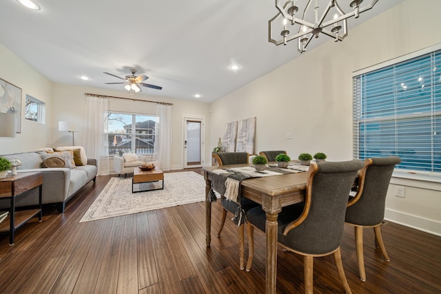 dining area with ceiling fan with notable chandelier, baseboards, dark wood-style flooring, and recessed lighting