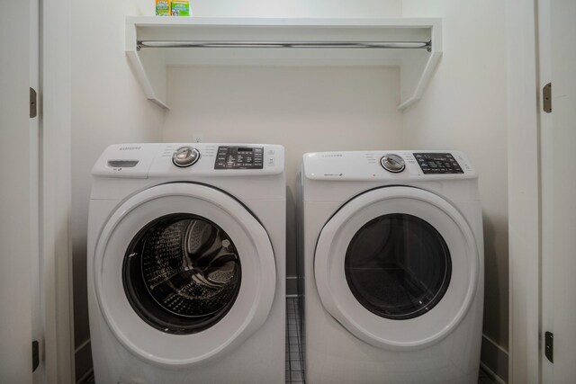 laundry area with washing machine and clothes dryer