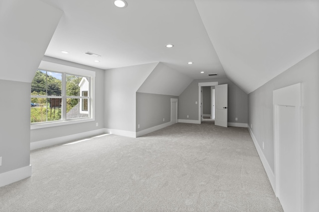 bonus room with recessed lighting, light colored carpet, visible vents, baseboards, and vaulted ceiling