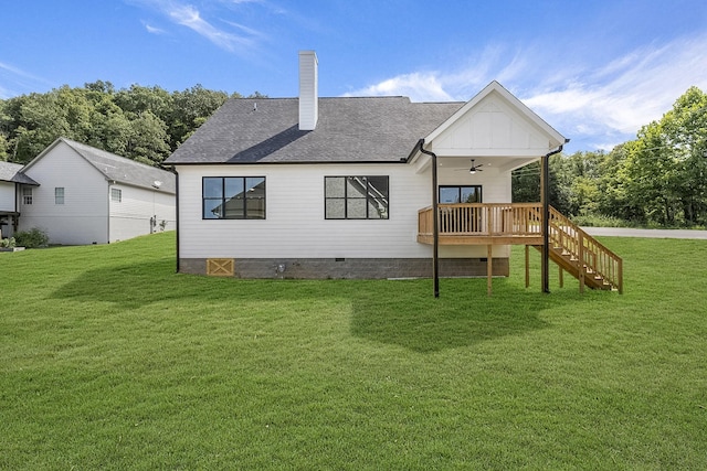 rear view of property with a yard, stairway, crawl space, and a ceiling fan