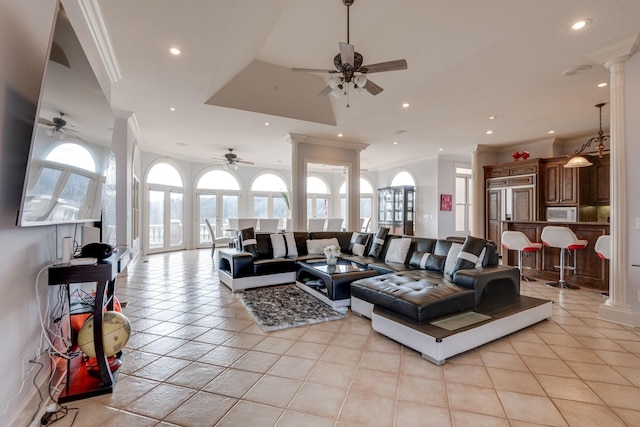 living room featuring light tile patterned floors, decorative columns, and recessed lighting