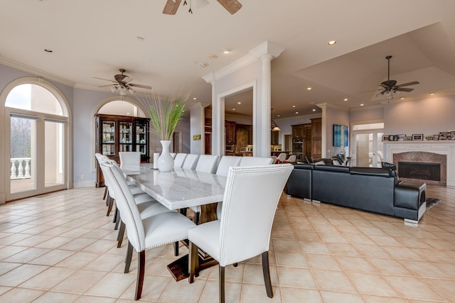 dining area featuring light tile patterned floors, ceiling fan, ornamental molding, a fireplace, and recessed lighting