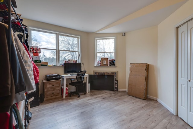 home office featuring baseboards and wood finished floors