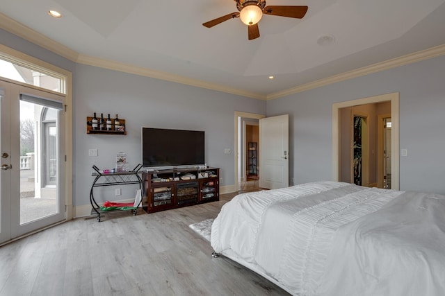 bedroom featuring french doors, crown molding, wood finished floors, access to outside, and baseboards