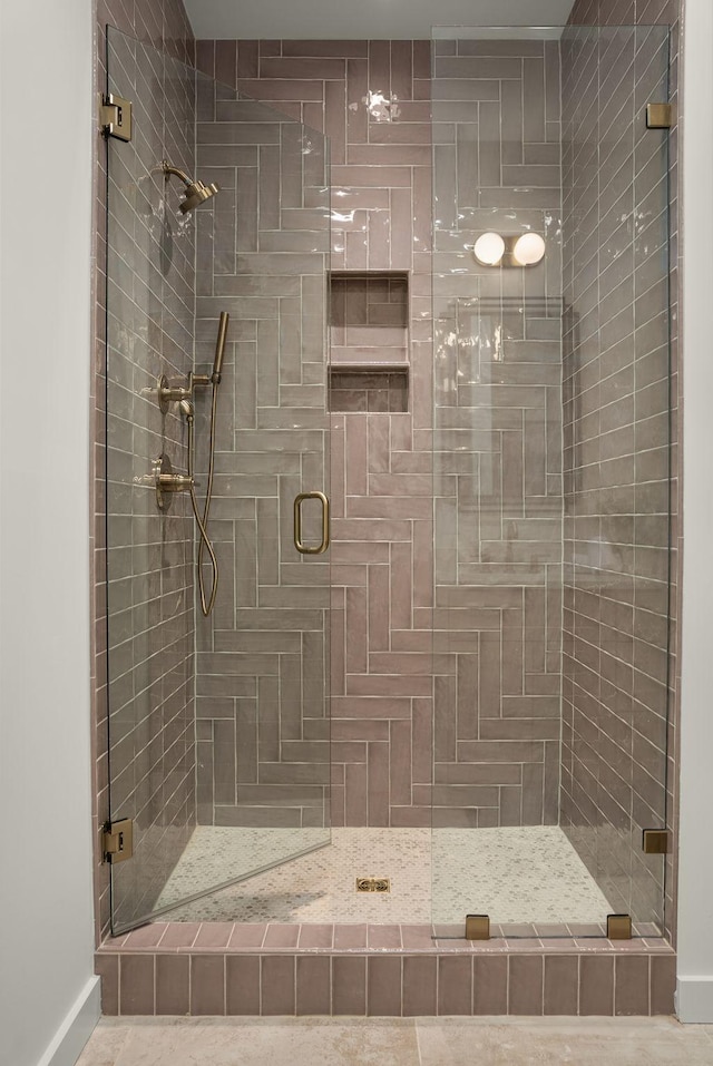 full bath with a shower stall