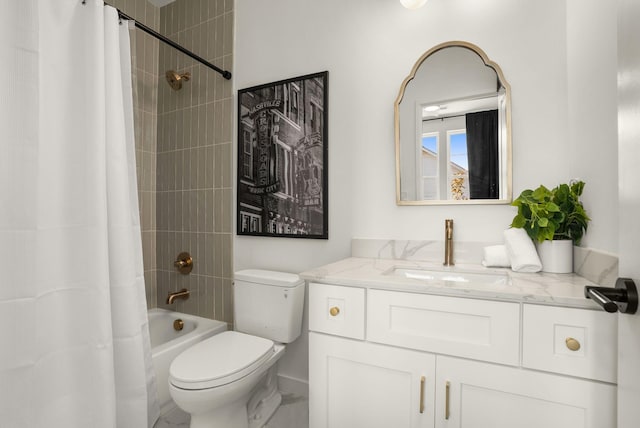 bathroom featuring toilet, shower / bath combo with shower curtain, and vanity