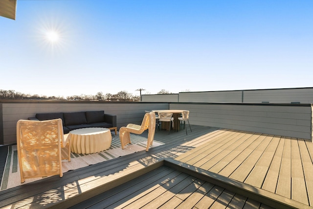 deck with an outdoor hangout area and outdoor dining space