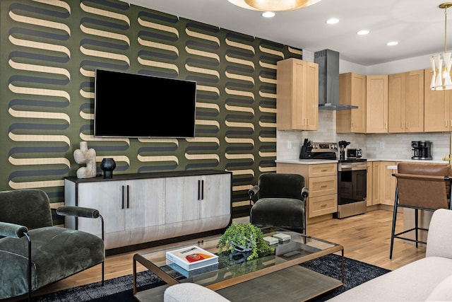 living area featuring recessed lighting and light wood-style flooring