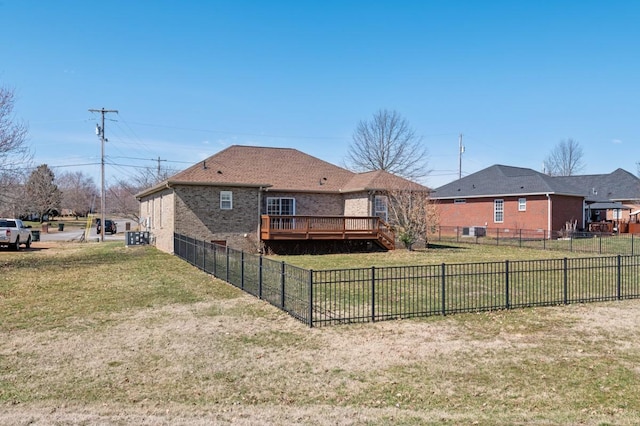 view of yard with fence and a deck