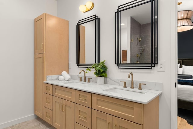 bathroom featuring walk in shower, a sink, ensuite bath, and double vanity