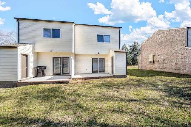 back of house featuring a yard and a patio