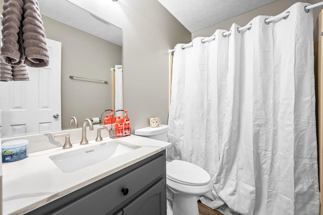 full bathroom with a shower with curtain, a textured ceiling, toilet, and vanity