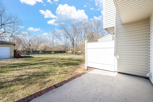 view of yard with fence and a patio