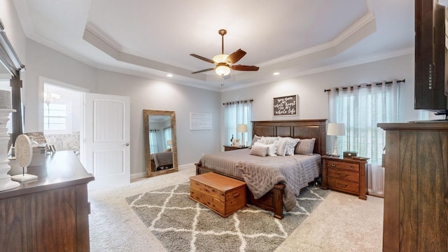 bedroom with carpet, a raised ceiling, crown molding, and baseboards