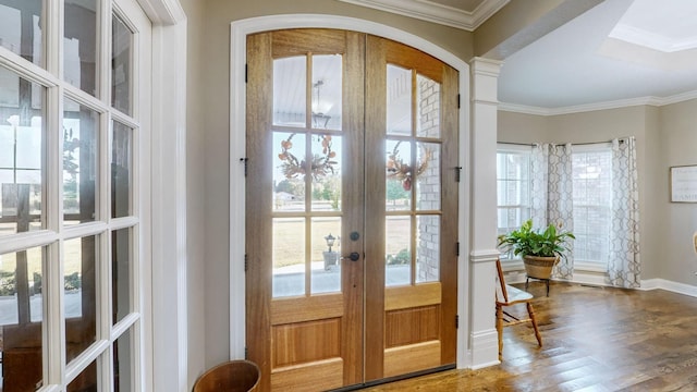 doorway featuring ornamental molding, a wealth of natural light, french doors, and wood finished floors