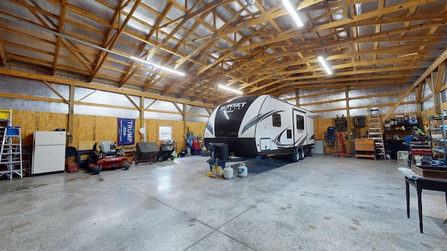 garage with freestanding refrigerator