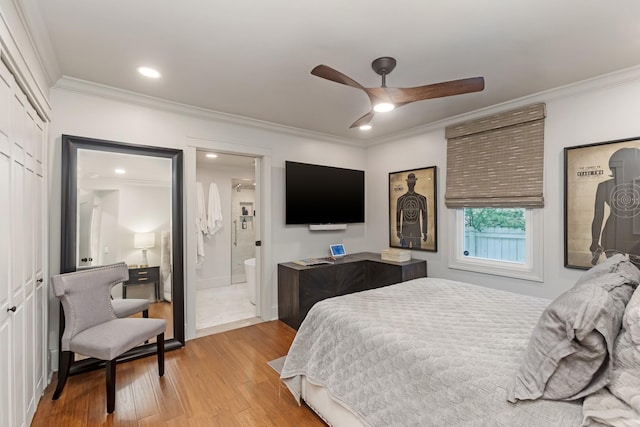 bedroom featuring a ceiling fan, light wood-style flooring, ensuite bathroom, crown molding, and recessed lighting