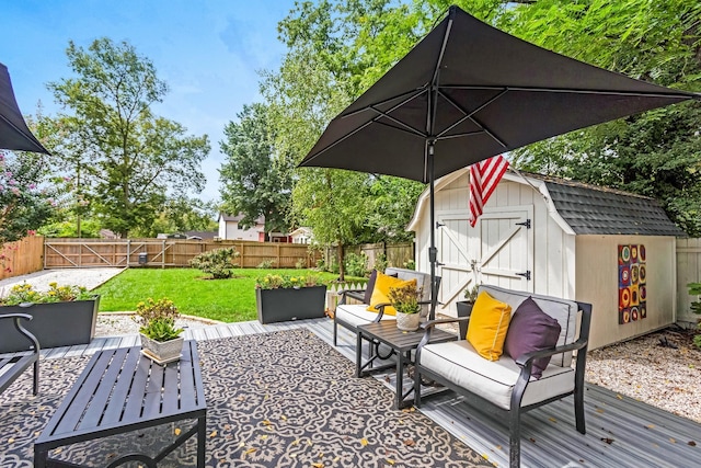 view of patio featuring a fenced backyard, an outdoor structure, an outdoor living space, and a storage unit