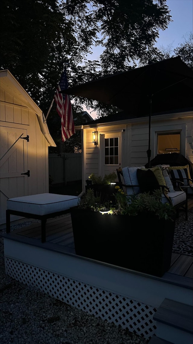 exterior space featuring board and batten siding and a wooden deck