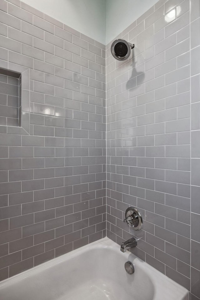 bathroom featuring  shower combination