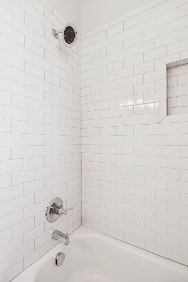 bathroom with shower / bathing tub combination