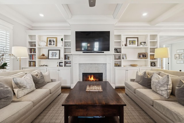 living room featuring dark wood-style floors, a warm lit fireplace, beamed ceiling, and ornamental molding