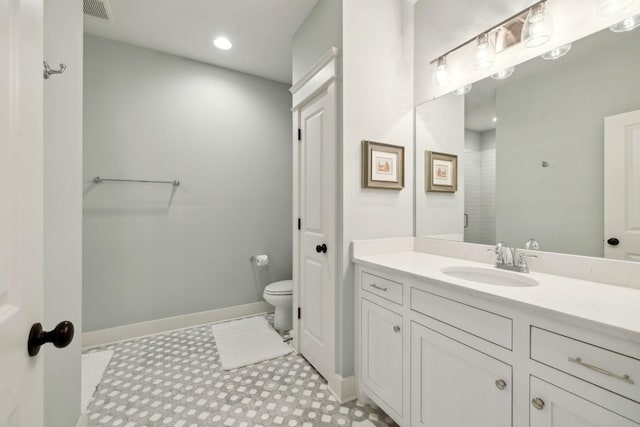 bathroom with recessed lighting, visible vents, toilet, vanity, and baseboards