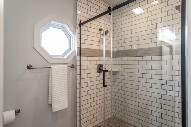 full bath featuring a shower stall