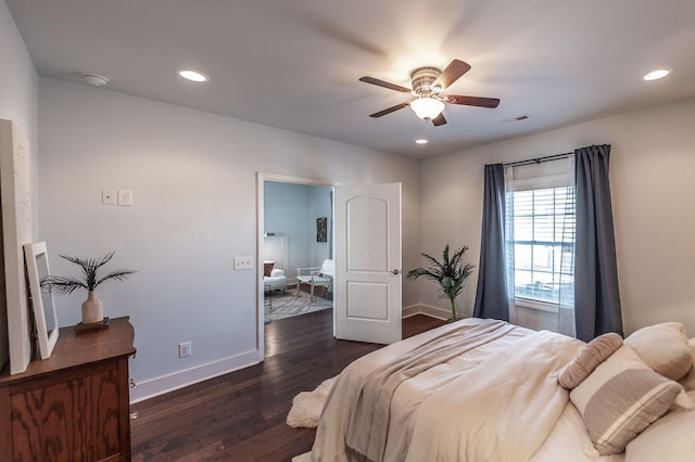 bedroom featuring visible vents, a ceiling fan, recessed lighting, baseboards, and dark wood-style flooring