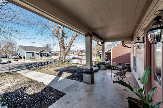 view of patio featuring a residential view and covered porch