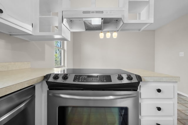 kitchen with white cabinets, under cabinet range hood, stainless steel appliances, and light countertops