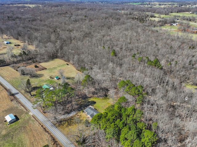 birds eye view of property with a rural view