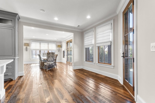 unfurnished living room with recessed lighting, ornamental molding, baseboards, and wood-type flooring