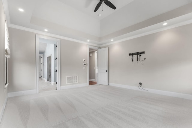 empty room featuring visible vents, ornamental molding, recessed lighting, baseboards, and light colored carpet