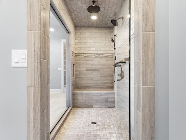 full bath featuring a tile shower