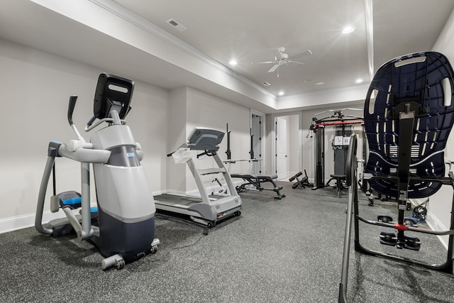 exercise area featuring visible vents, a tray ceiling, recessed lighting, crown molding, and baseboards