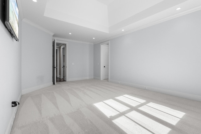 unfurnished room with recessed lighting, light colored carpet, crown molding, and baseboards