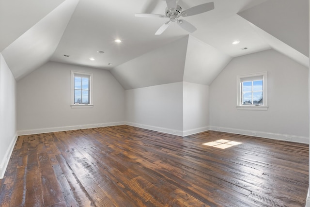 bonus room featuring vaulted ceiling, baseboards, and wood-type flooring