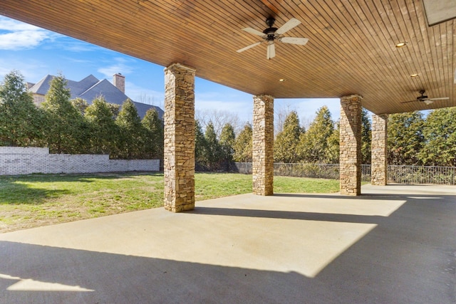 view of patio / terrace with a ceiling fan and fence