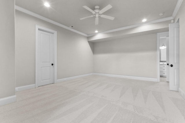 unfurnished room with recessed lighting, light colored carpet, baseboards, and ornamental molding