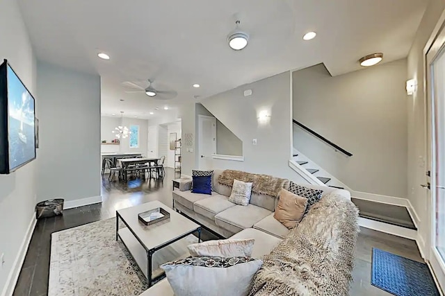 living room with baseboards, stairway, wood finished floors, and recessed lighting