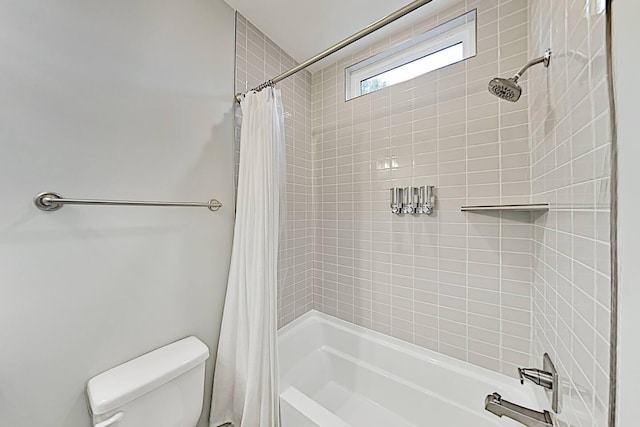 full bathroom featuring shower / bath combination with curtain and toilet