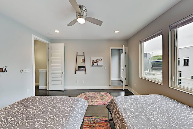 bedroom with ceiling fan, recessed lighting, dark wood finished floors, and baseboards