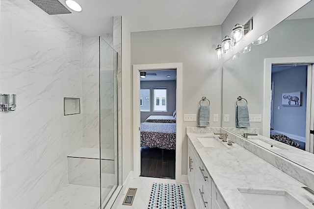 ensuite bathroom featuring a sink, connected bathroom, and visible vents