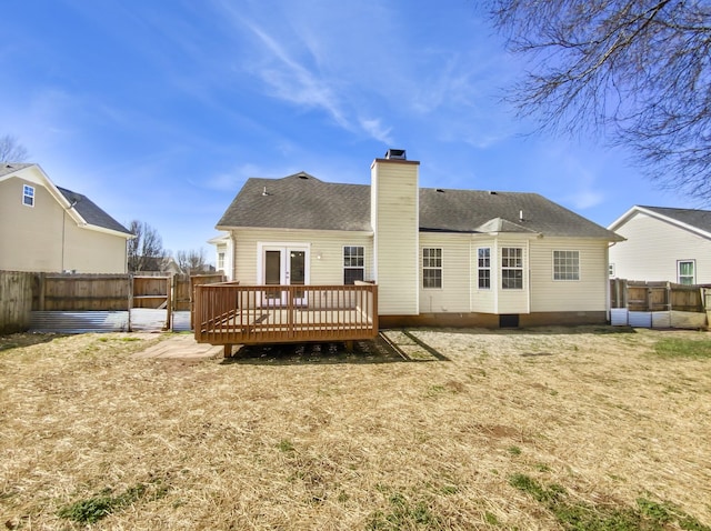 1173 Snoopy Dr, Clarksville, TN 37040 - rear view of property featuring a fenced backyard, a yard, a chimney, and a wooden deck